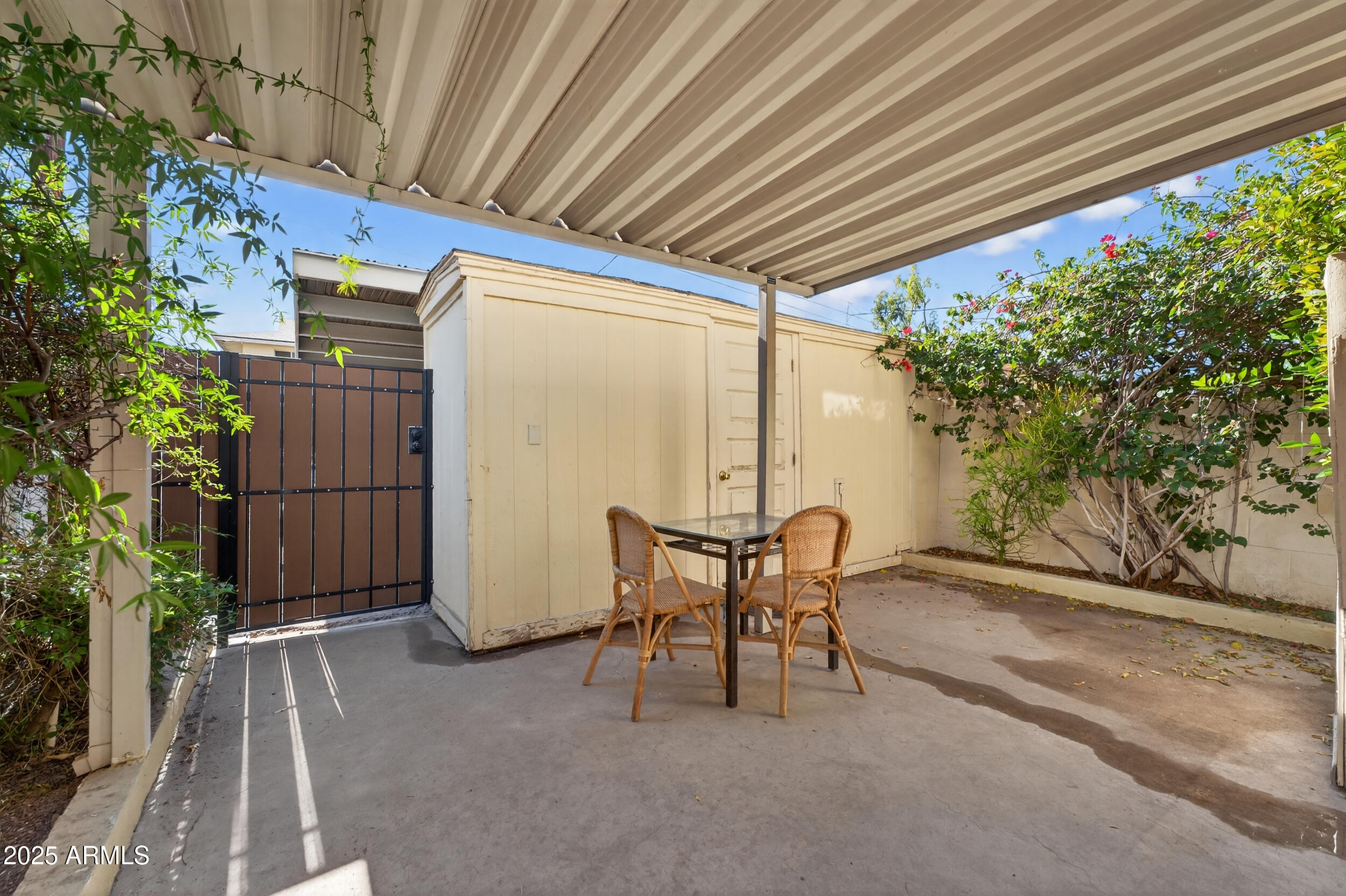 3929 South Mill Avenue Tempe, AZ 85282 - Photo 23 of 26 a patio with table and chairs and potted plants