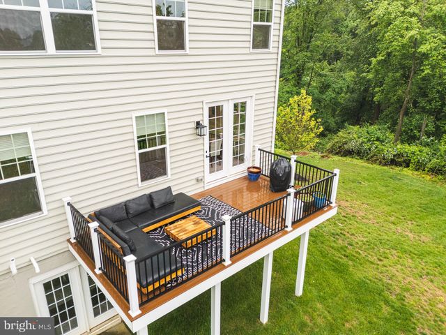 a view of balcony with deck and wooden floor
