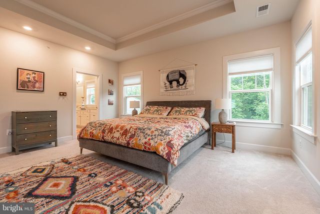 a bedroom with a bed and a television