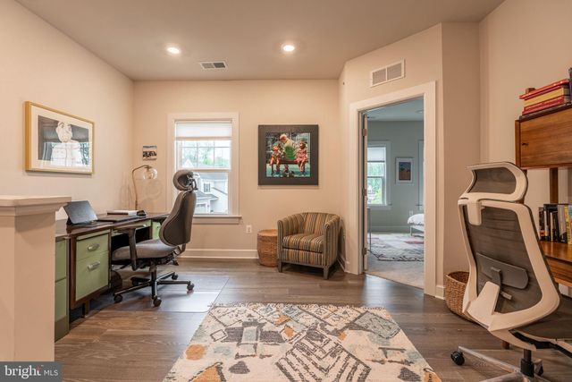 a view of a workspace with furniture and a workspace
