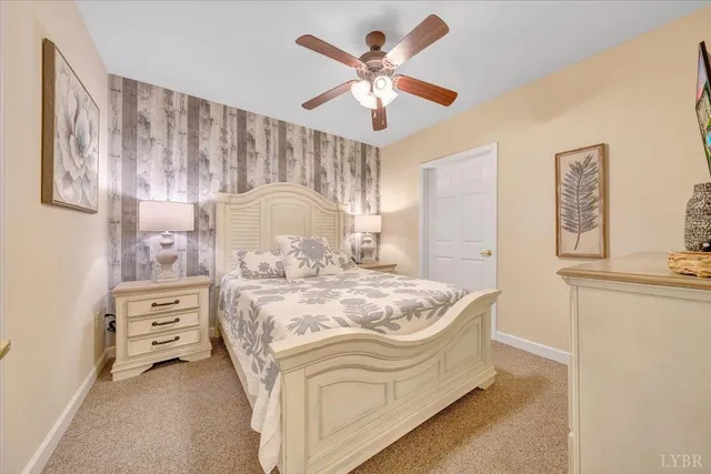 a spacious bedroom with a bed and a cabinets
