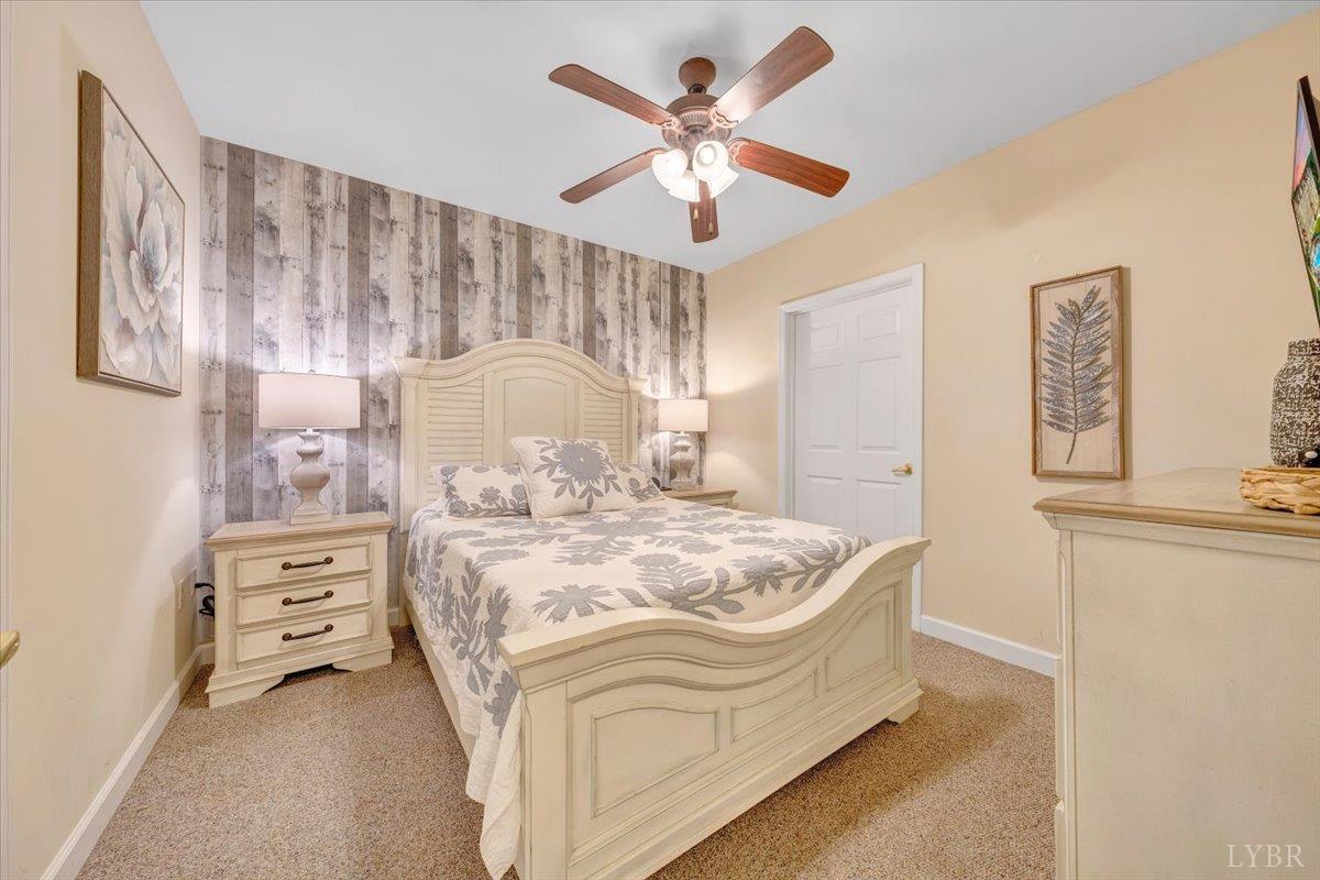 1273 Graves Harbor Trail, Unit 324 Huddleston, VA 24104 - Photo 19 of 25 a spacious bedroom with a bed and a cabinets