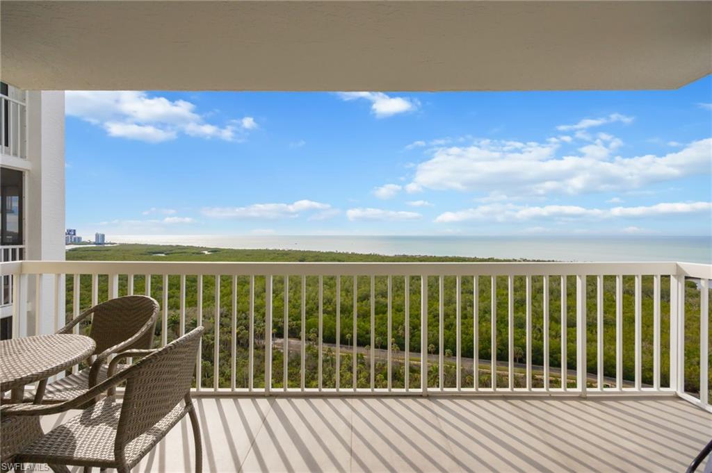 6573 Marissa Loop, Unit 2005 Naples, FL 34108 - Photo 2 of 25 a view of balcony with wooden floor and seating space