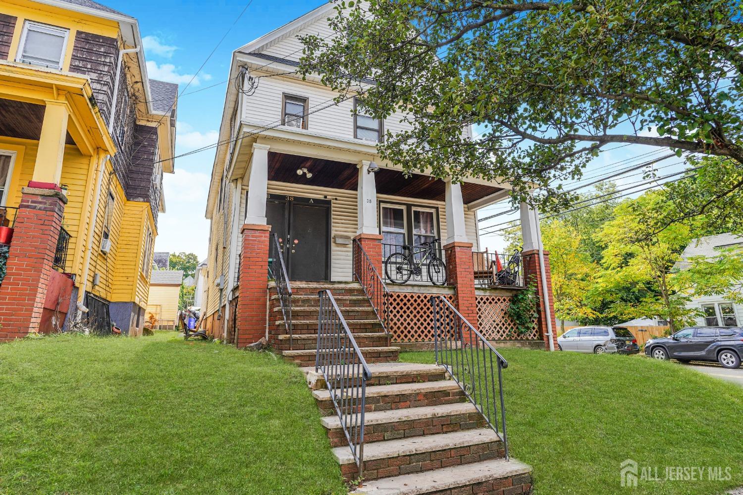 38 Handy Street New Brunswick, NJ 08901 - Photo 2 of 32 a front view of a house with a yard