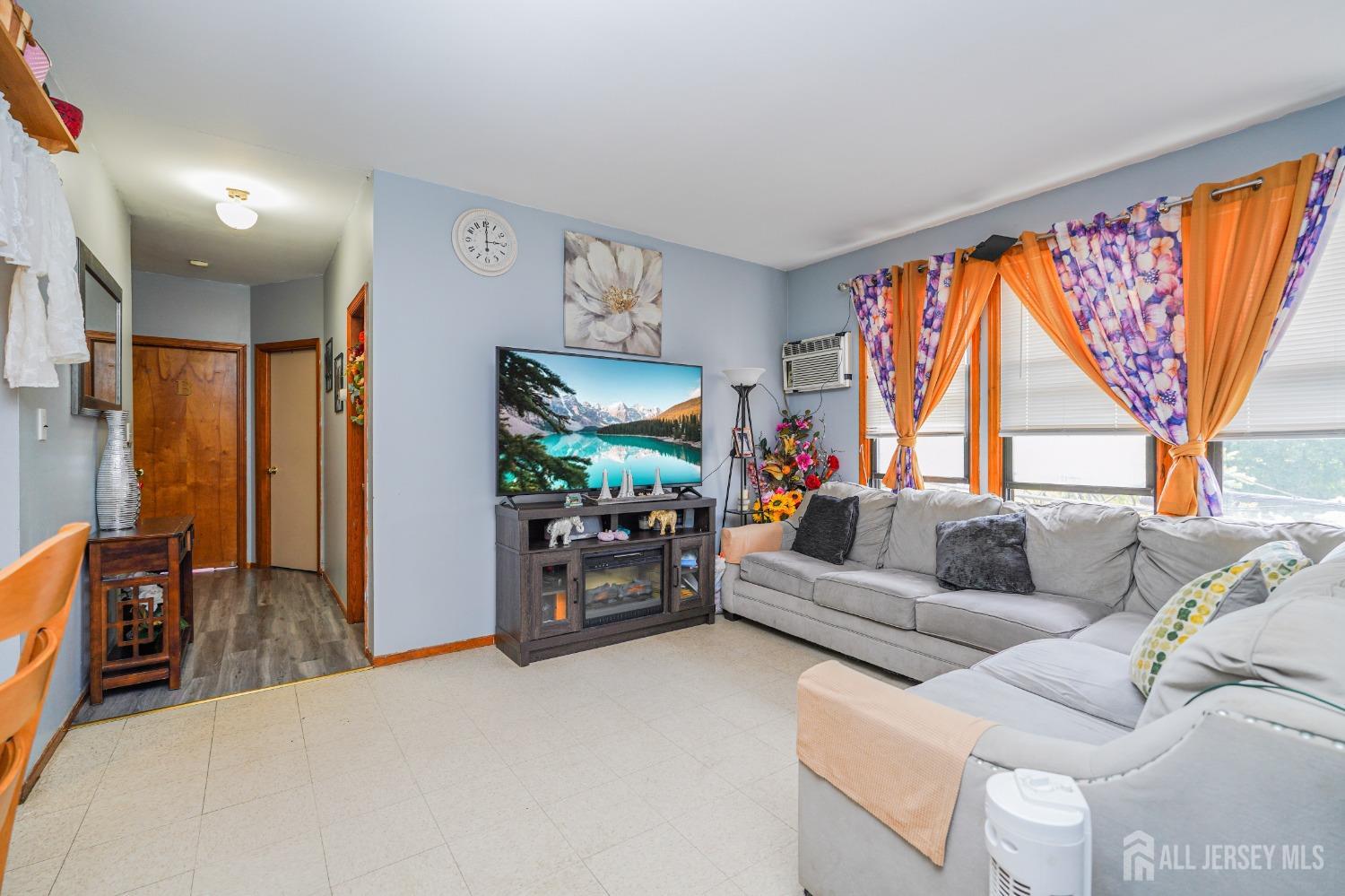 38 Handy Street New Brunswick, NJ 08901 - Photo 5 of 32 a living room with furniture and a flat screen tv