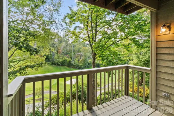 a view of balcony with wooden floor