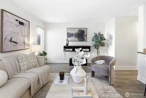 a living room with furniture flowerpot and window