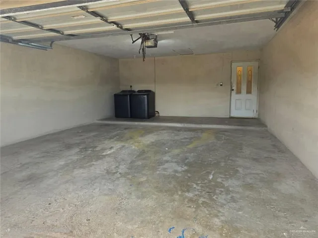 a view of a big room with a ceiling fan
