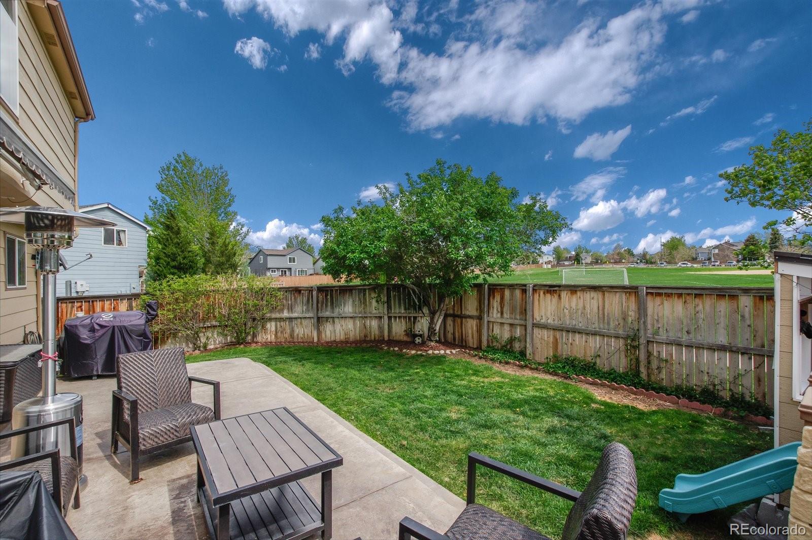 9701 Moss Rose Circle Highlands Ranch, CO 80129 - Photo 39 of 40 a view of a patio with a chairs