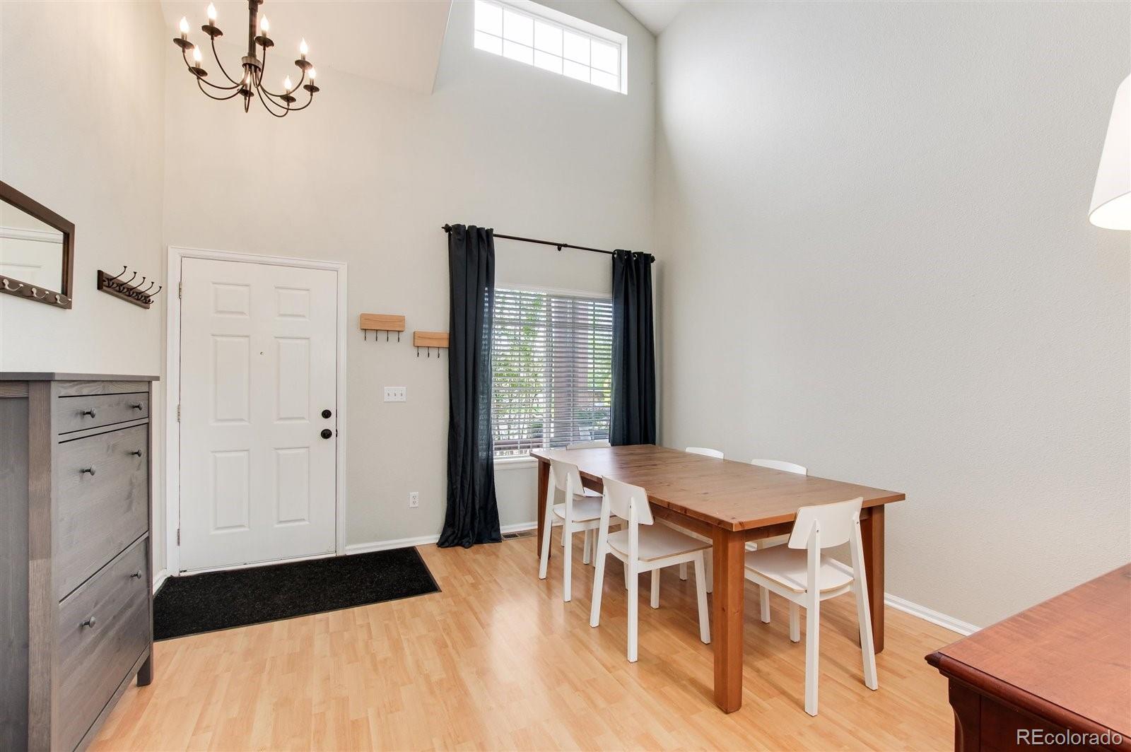 9701 Moss Rose Circle Highlands Ranch, CO 80129 - Photo 10 of 40 a view of a dining room with furniture
