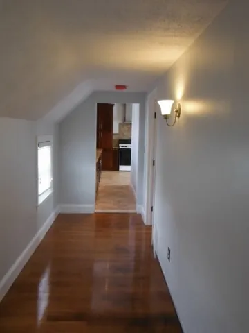wooden floor in a hall with a mirror