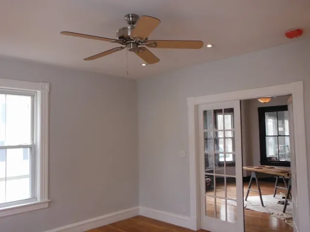 a kitchen with granite countertop a stove a sink and a microwave