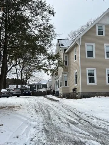 a view of road with card and trees