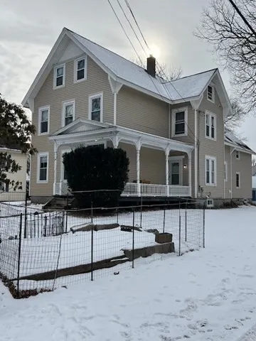a front view of a house with a garage