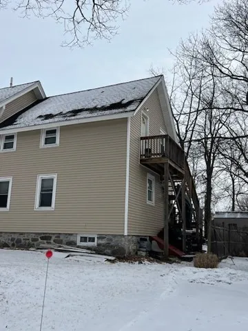 a view of garage and a yard