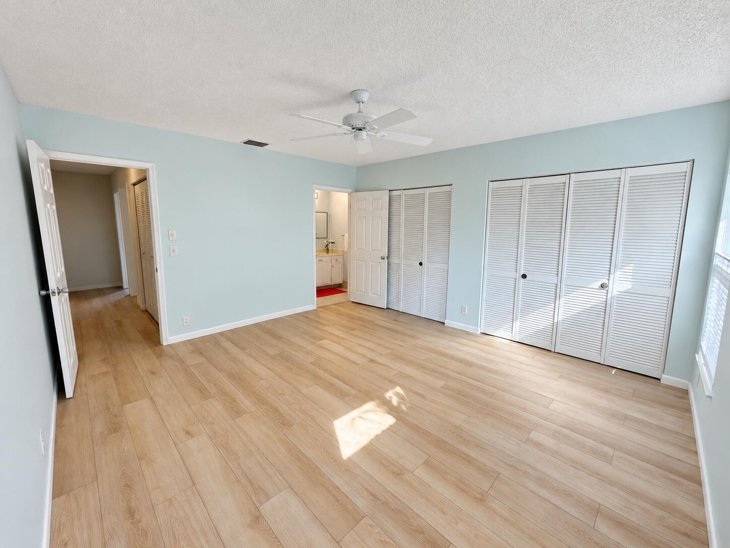 6309 Dusenburg Road Delray Beach, FL 33484 - Photo 17 of 26 Airy primary bedroom in natural daylight