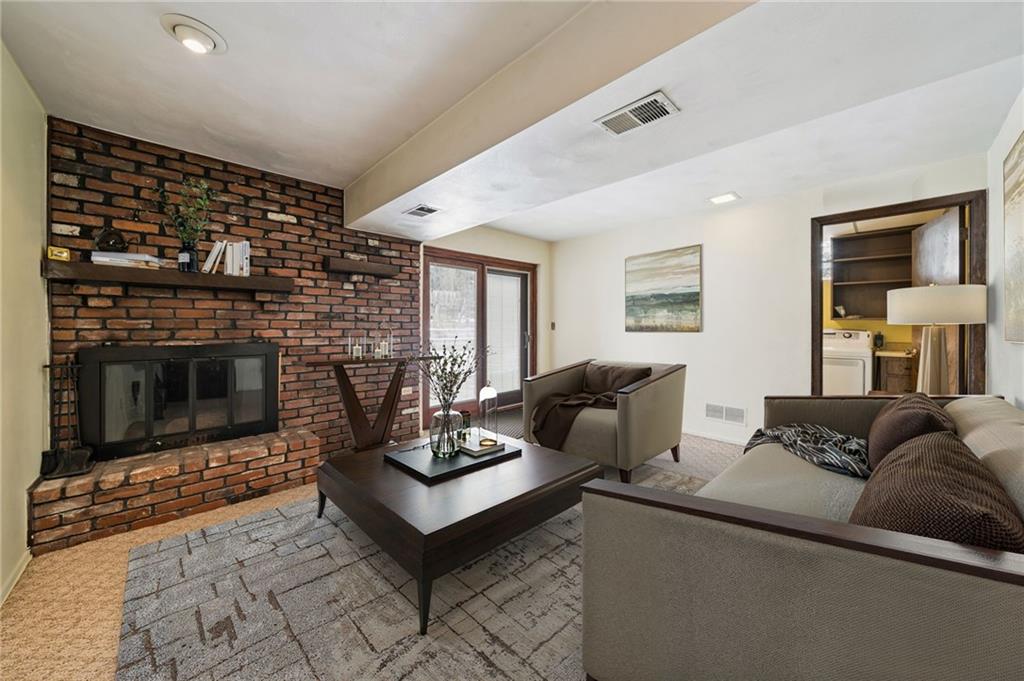 982 Braddock Road Pittsburgh, PA 15221 - Photo 14 of 32 a living room with furniture and a fireplace