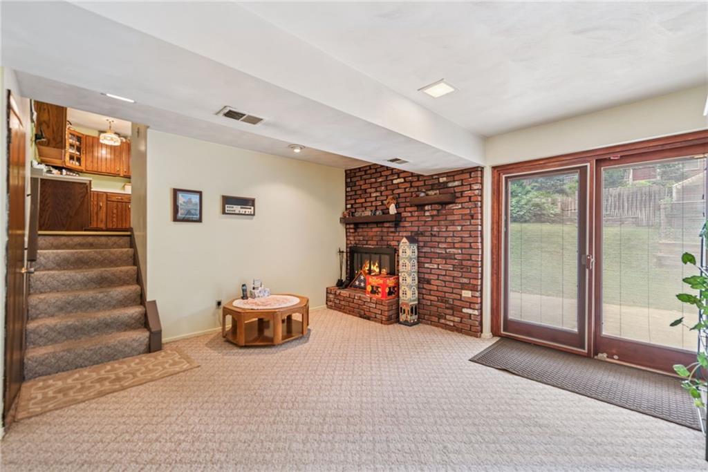 982 Braddock Road Pittsburgh, PA 15221 - Photo 16 of 32 a view of a livingroom with furniture and staircase