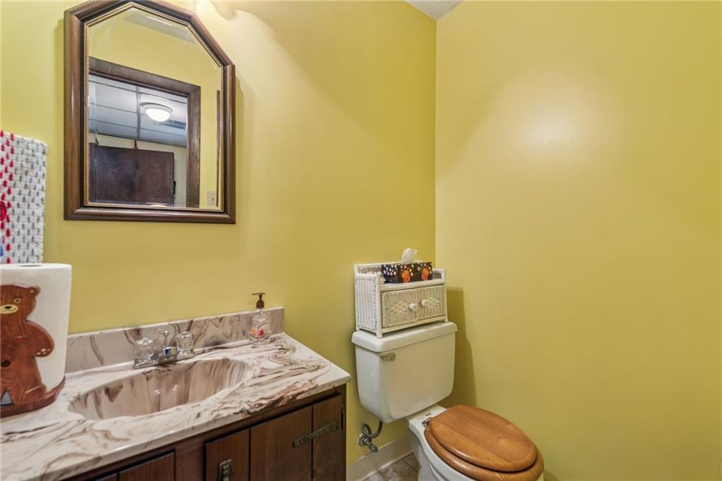 982 Braddock Road Pittsburgh, PA 15221 - Photo 18 of 32 a bathroom with a sink and a toilet