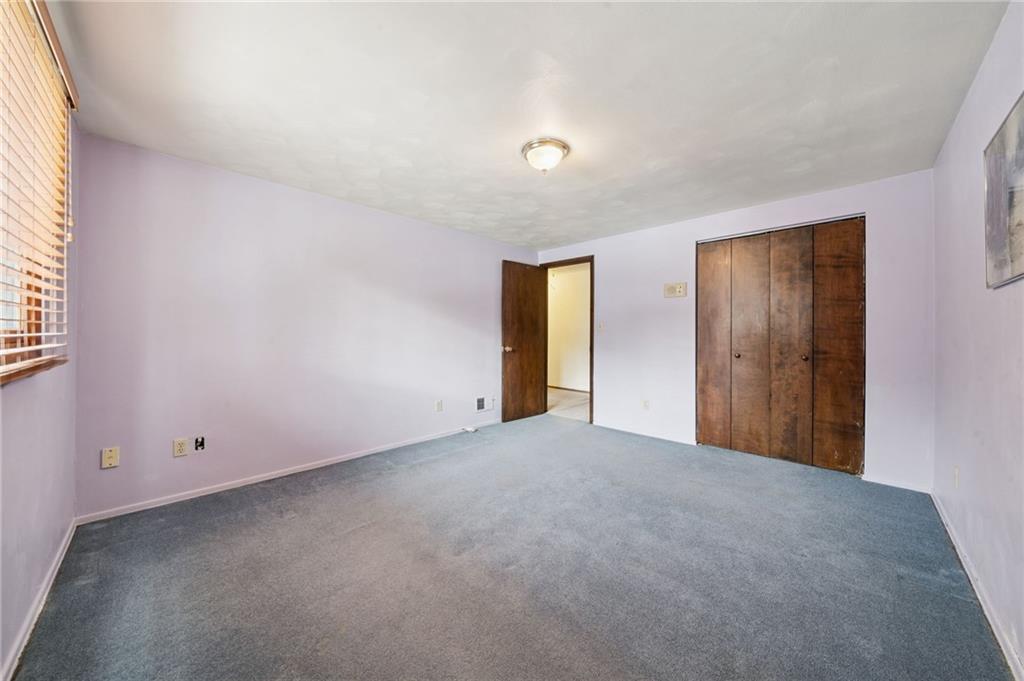 982 Braddock Road Pittsburgh, PA 15221 - Photo 23 of 32 a view of an empty room with a window