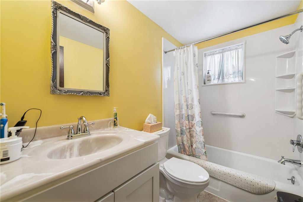 982 Braddock Road Pittsburgh, PA 15221 - Photo 25 of 32 a bathroom with a sink toilet and shower