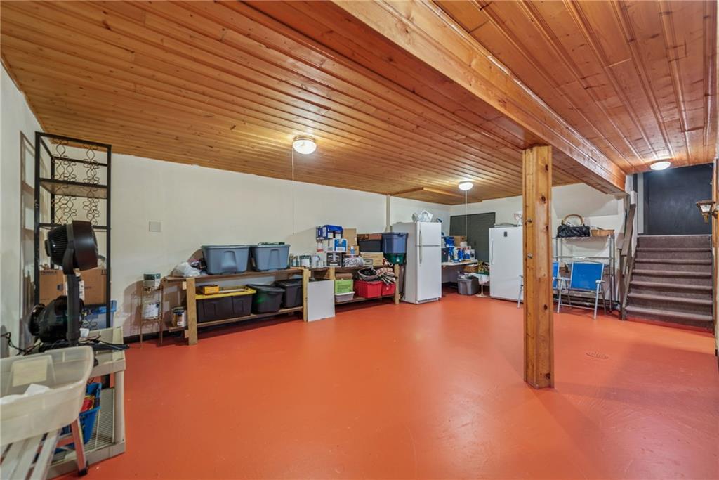 982 Braddock Road Pittsburgh, PA 15221 - Photo 31 of 32 a view of a livingroom with furniture and a garage
