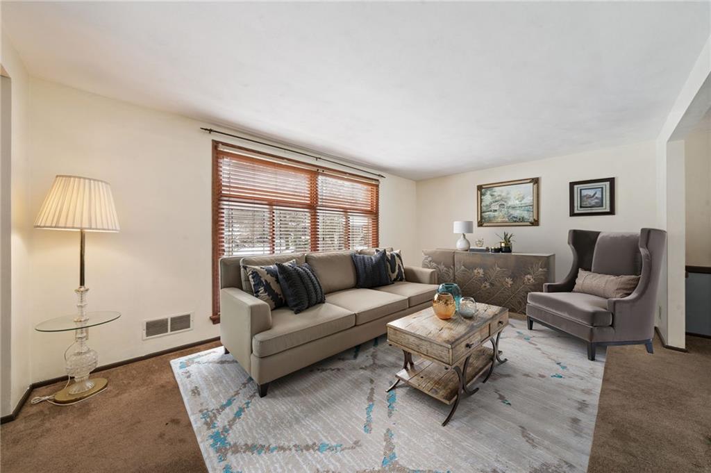 982 Braddock Road Pittsburgh, PA 15221 - Photo 5 of 32 a living room with furniture and a window