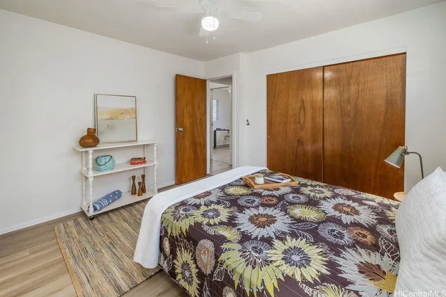 a bedroom with a bed and a dresser