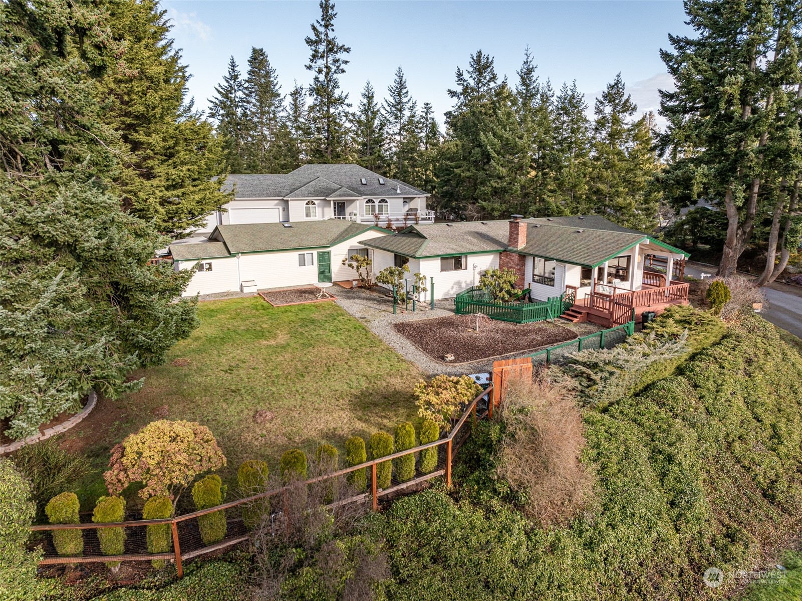 126 Hogans Vista Sequim, WA 98382 - Photo 1 of 40 a aerial view of a house with table and chairs and potted plants