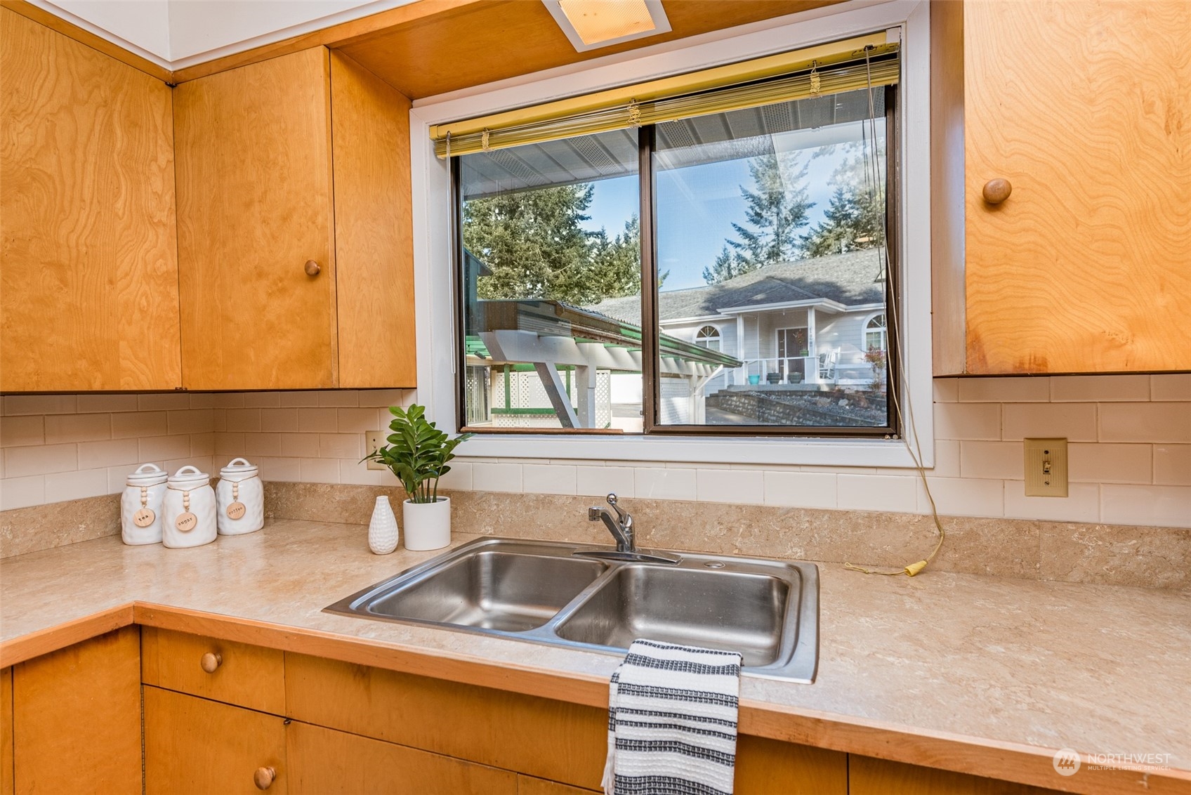 126 Hogans Vista Sequim, WA 98382 - Photo 15 of 40 a kitchen with a sink and a window