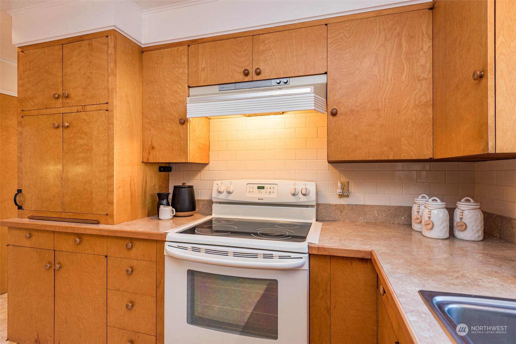 126 Hogans Vista Sequim, WA 98382 - Photo 16 of 40 a kitchen with granite countertop cabinets stainless steel appliances and a counter space