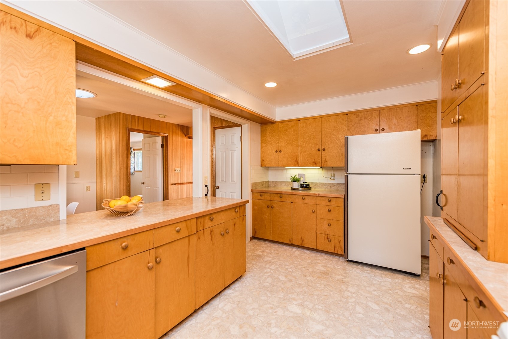 126 Hogans Vista Sequim, WA 98382 - Photo 17 of 40 a kitchen with sink refrigerator and cabinets