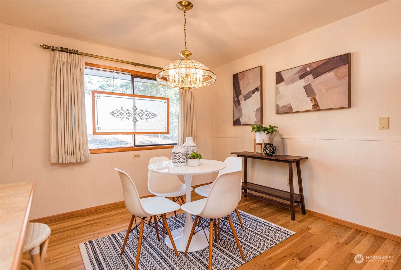 126 Hogans Vista Sequim, WA 98382 - Photo 19 of 40 a view of a dining room with furniture window and wooden floor