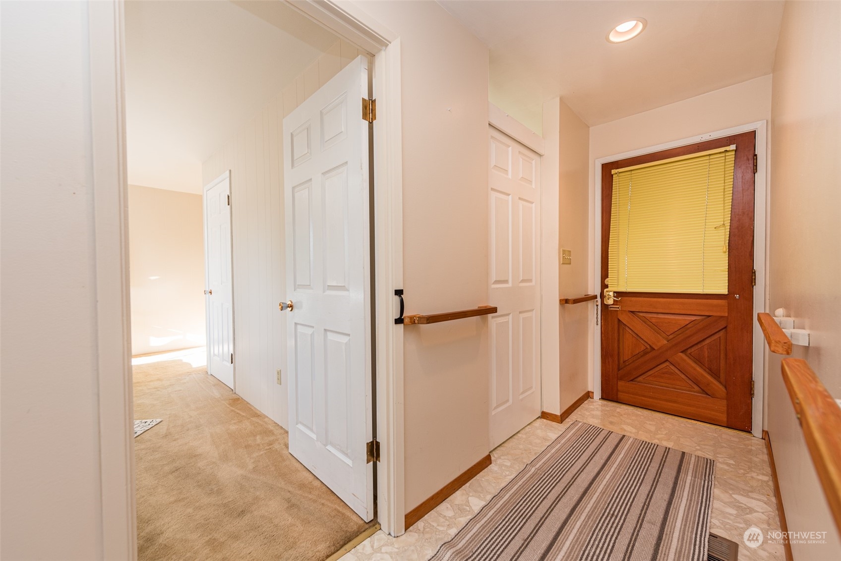 126 Hogans Vista Sequim, WA 98382 - Photo 20 of 40 a view of a hallway with wooden floor and closet