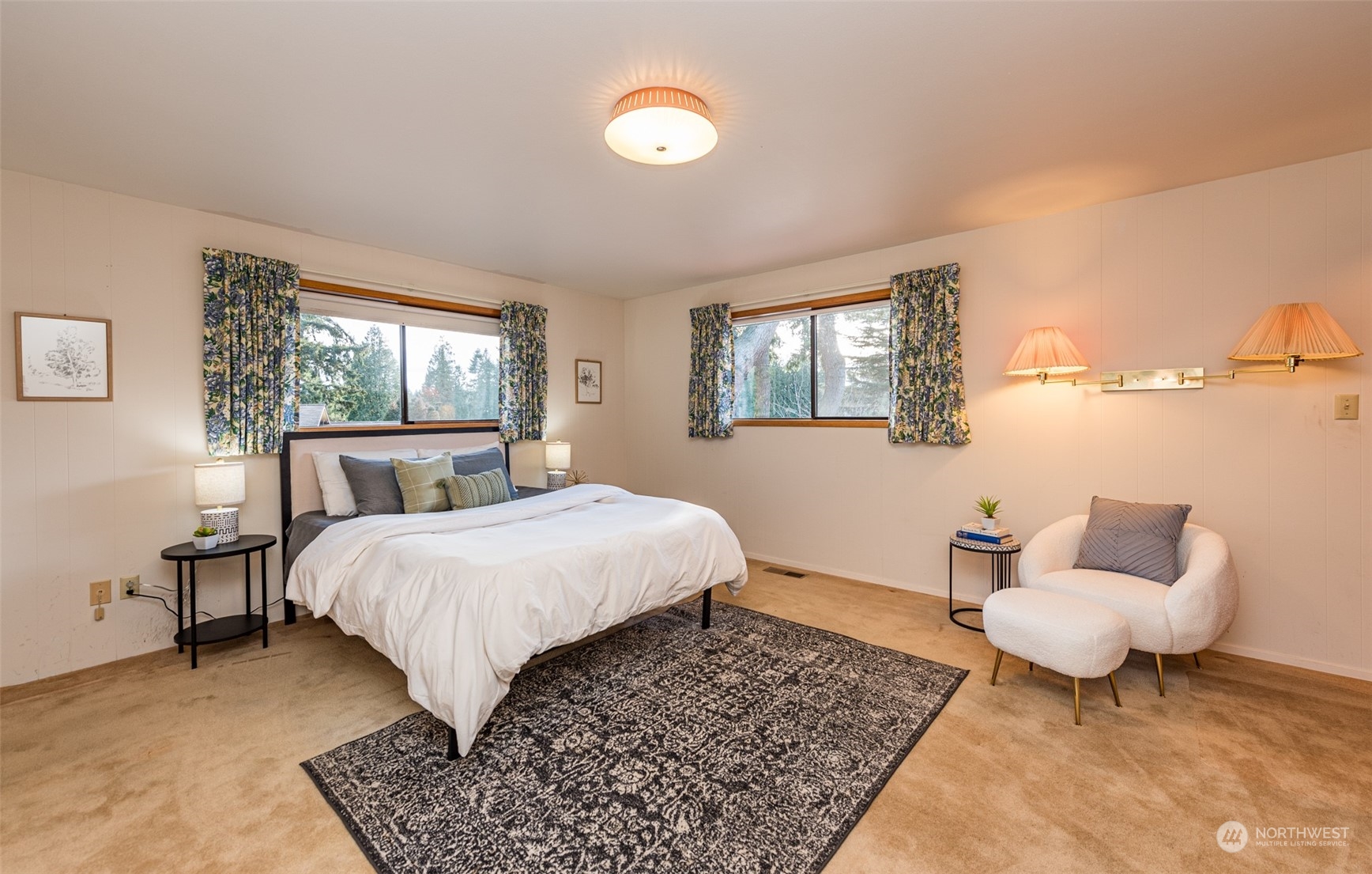 126 Hogans Vista Sequim, WA 98382 - Photo 25 of 40 a bedroom with a bed and a couch