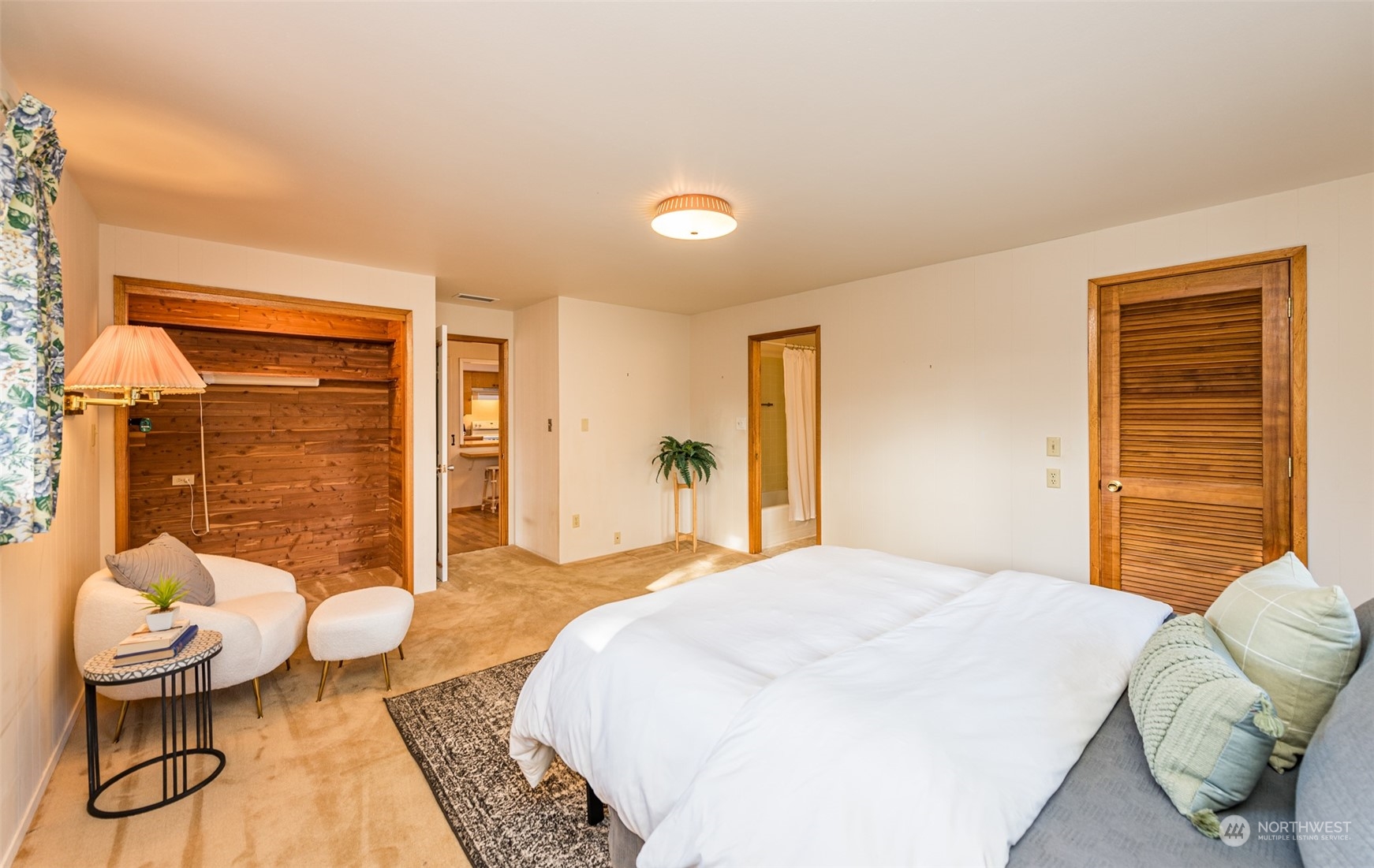 126 Hogans Vista Sequim, WA 98382 - Photo 26 of 40 a bedroom with a bed and wooden floor