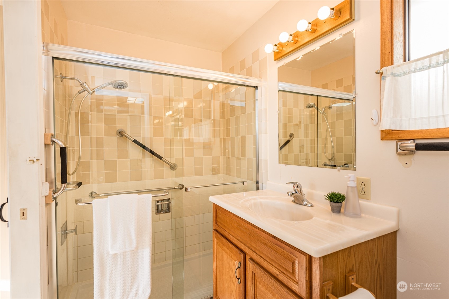 126 Hogans Vista Sequim, WA 98382 - Photo 28 of 40 a bathroom with a sink and a mirror