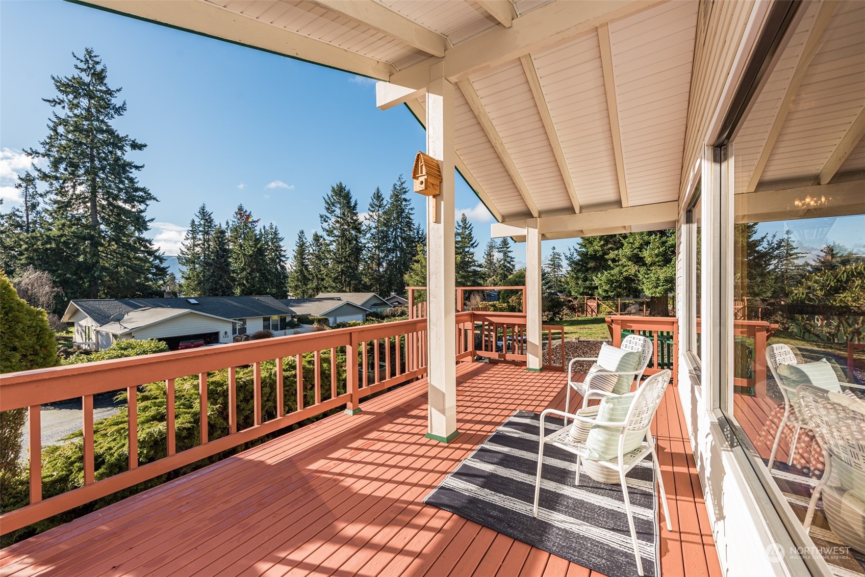 126 Hogans Vista Sequim, WA 98382 - Photo 31 of 40 a view of balcony with wooden floor and outdoor seating