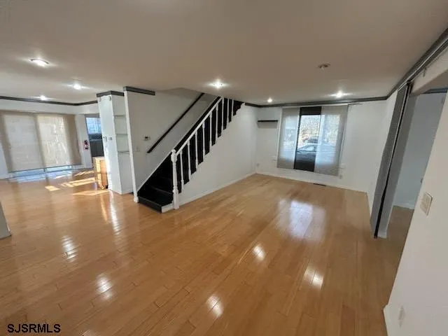 a kitchen with refrigerator and window