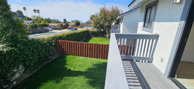 a view of a backyard with sitting area