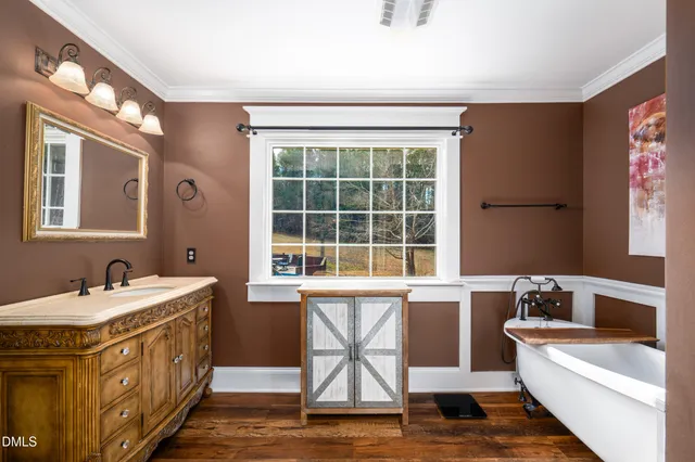 a bedroom that has a bed and a window in it