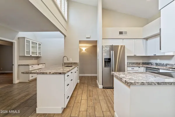 a kitchen with a sink stove and refrigerator