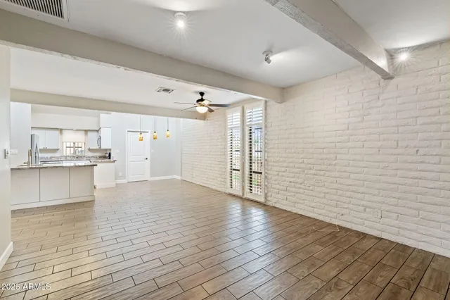 a view of kitchen with furniture and wooden floor