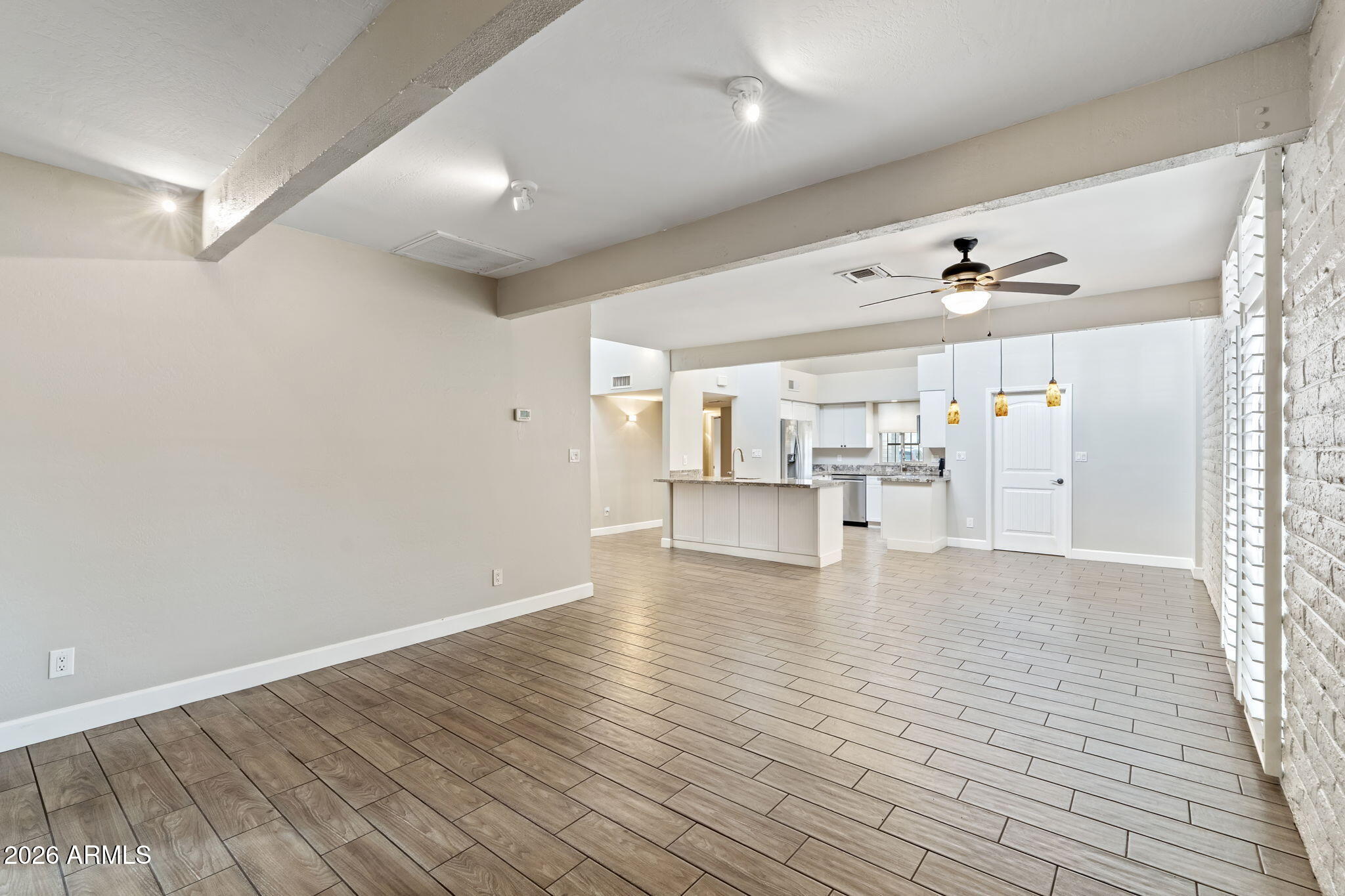 7840 North 7th Street, Unit 1 Phoenix, AZ 85020 - Photo 19 of 42 a view of kitchen with furniture and wooden floor