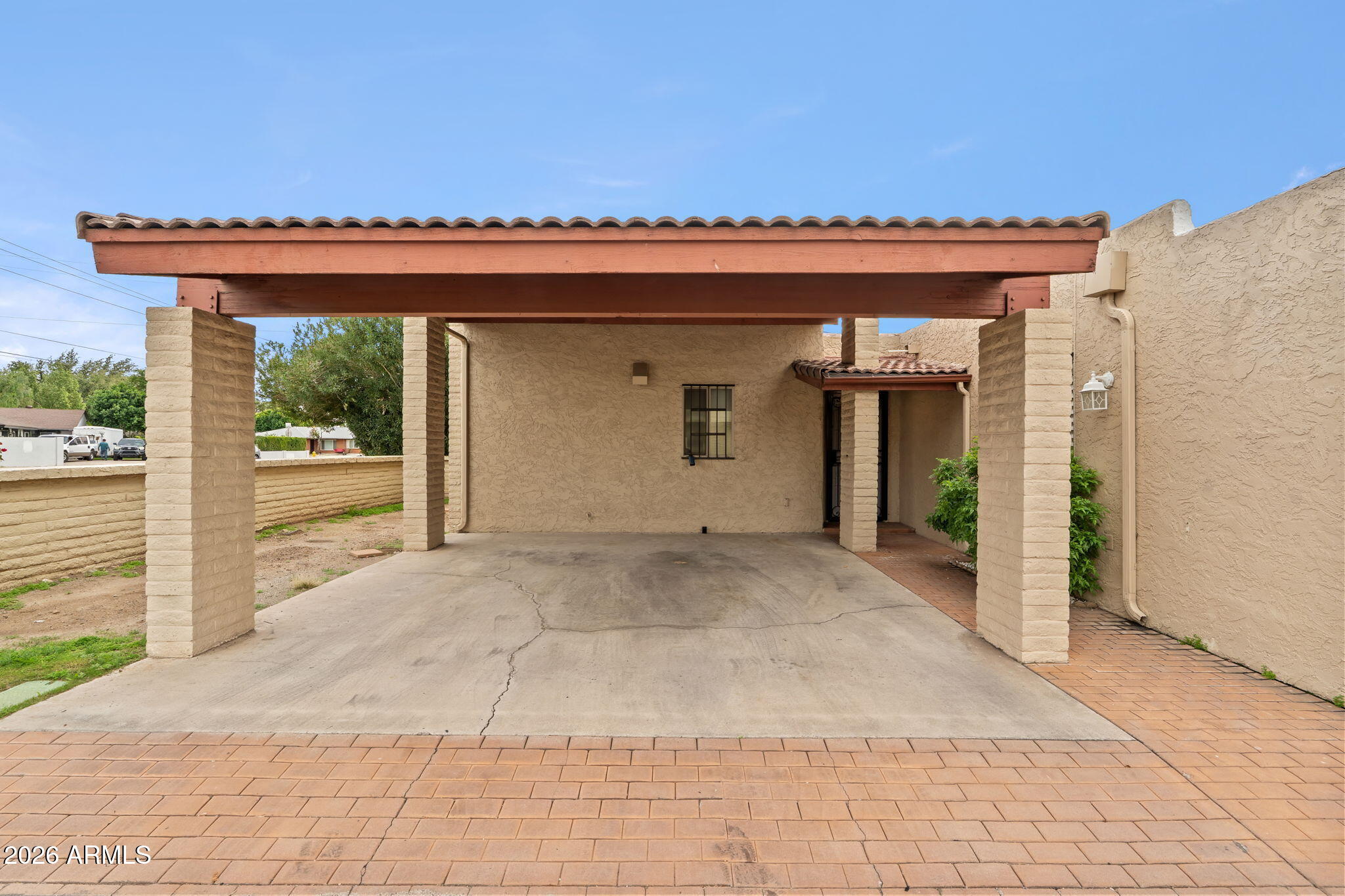 7840 North 7th Street, Unit 1 Phoenix, AZ 85020 - Photo 3 of 42 front view of a house with a large window and potted plants