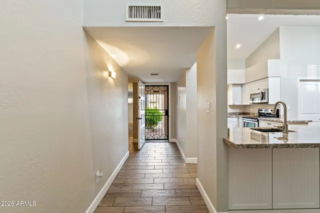 a view of a kitchen from the hallway