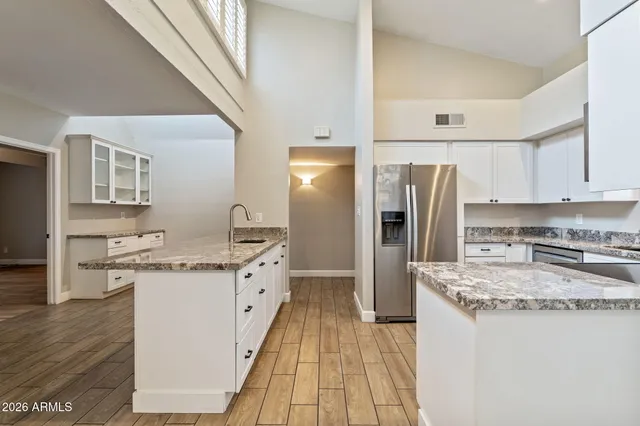 a kitchen with a sink stove and refrigerator
