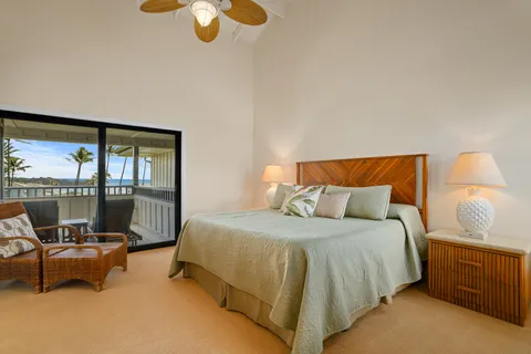 a bedroom with a bed and glass window