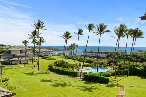 a view of a swimming pool with a garden and swimming pool