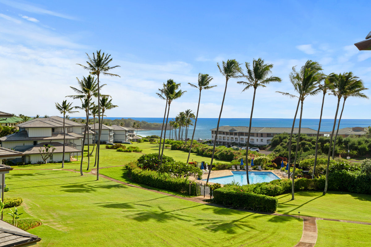 1565 Pe'e Road, Unit 125 Koloa, HI 96756 - Photo 18 of 19 a view of a swimming pool with a garden and swimming pool